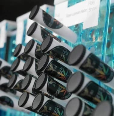 Pre-rolled joints in cones neatly displayed on the shelf at Andaman Genetics dispensary